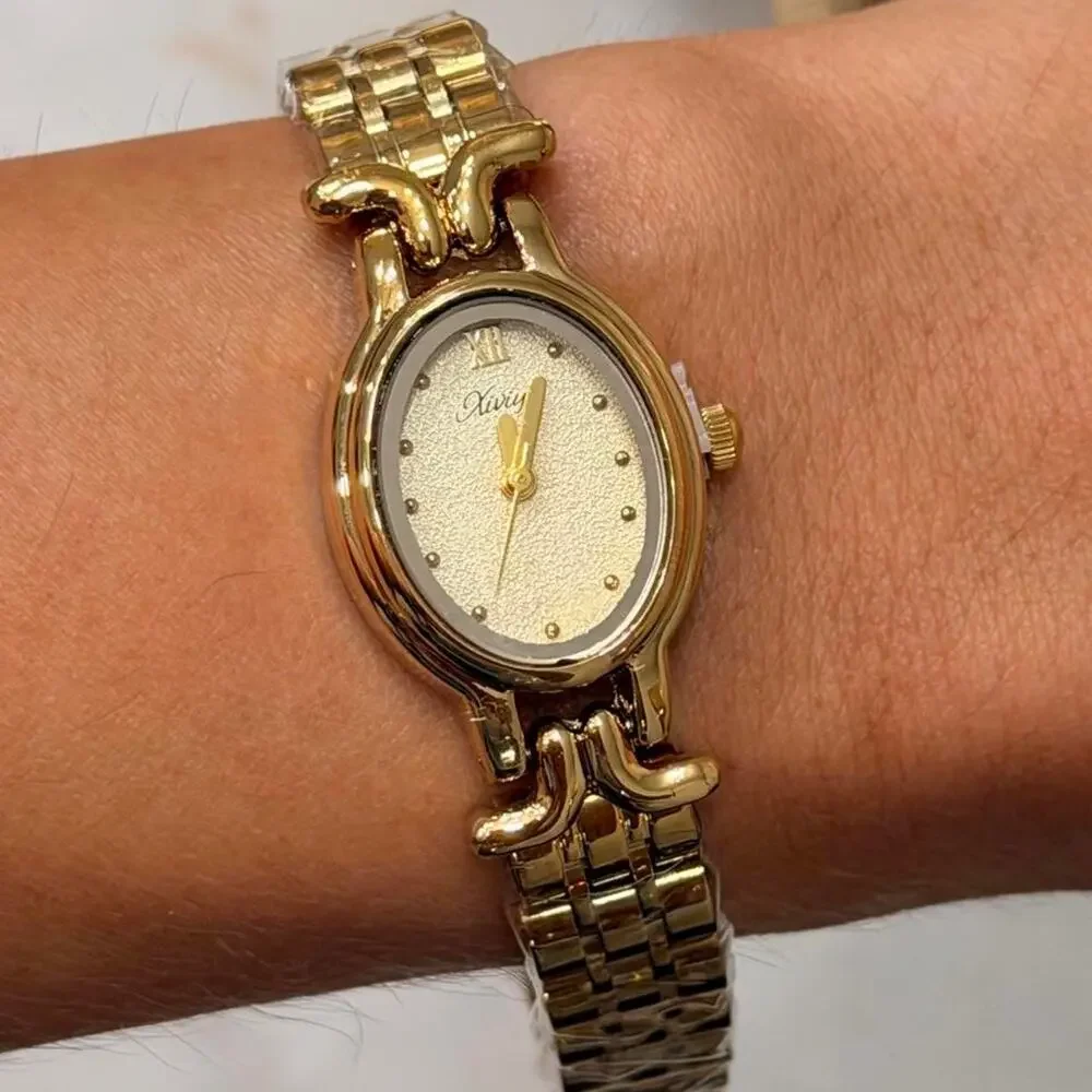 Gold watch with white face
